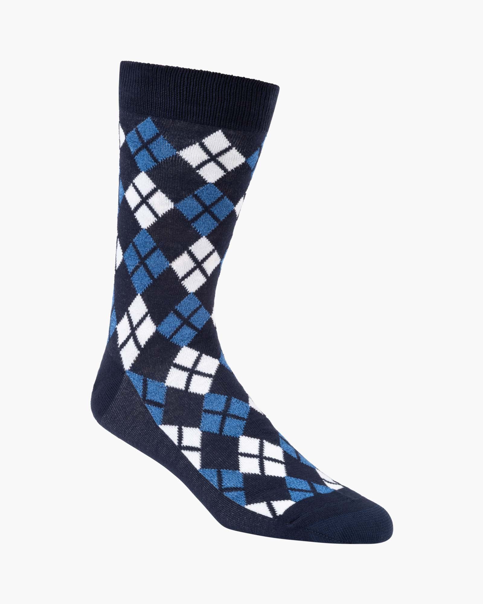Navy blue sock with a blue and white argyle pattern 