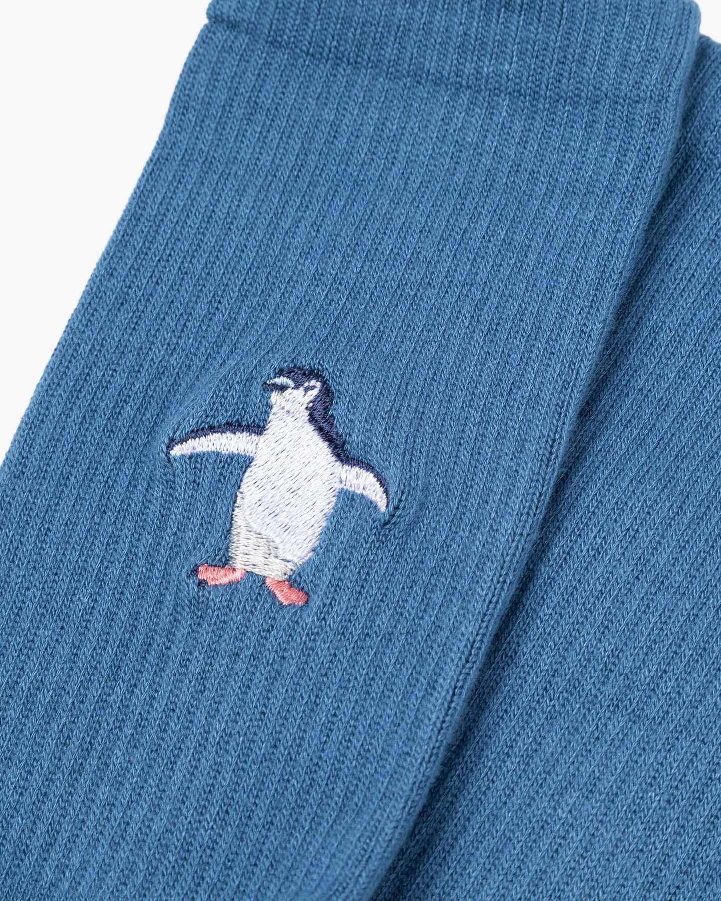 denim sports sock with a penguin design