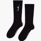 black sock with a golf-themed design