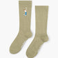 sage sock with a golf-themed design