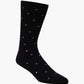 black crew sock with a pattern of small multicolored polka dots