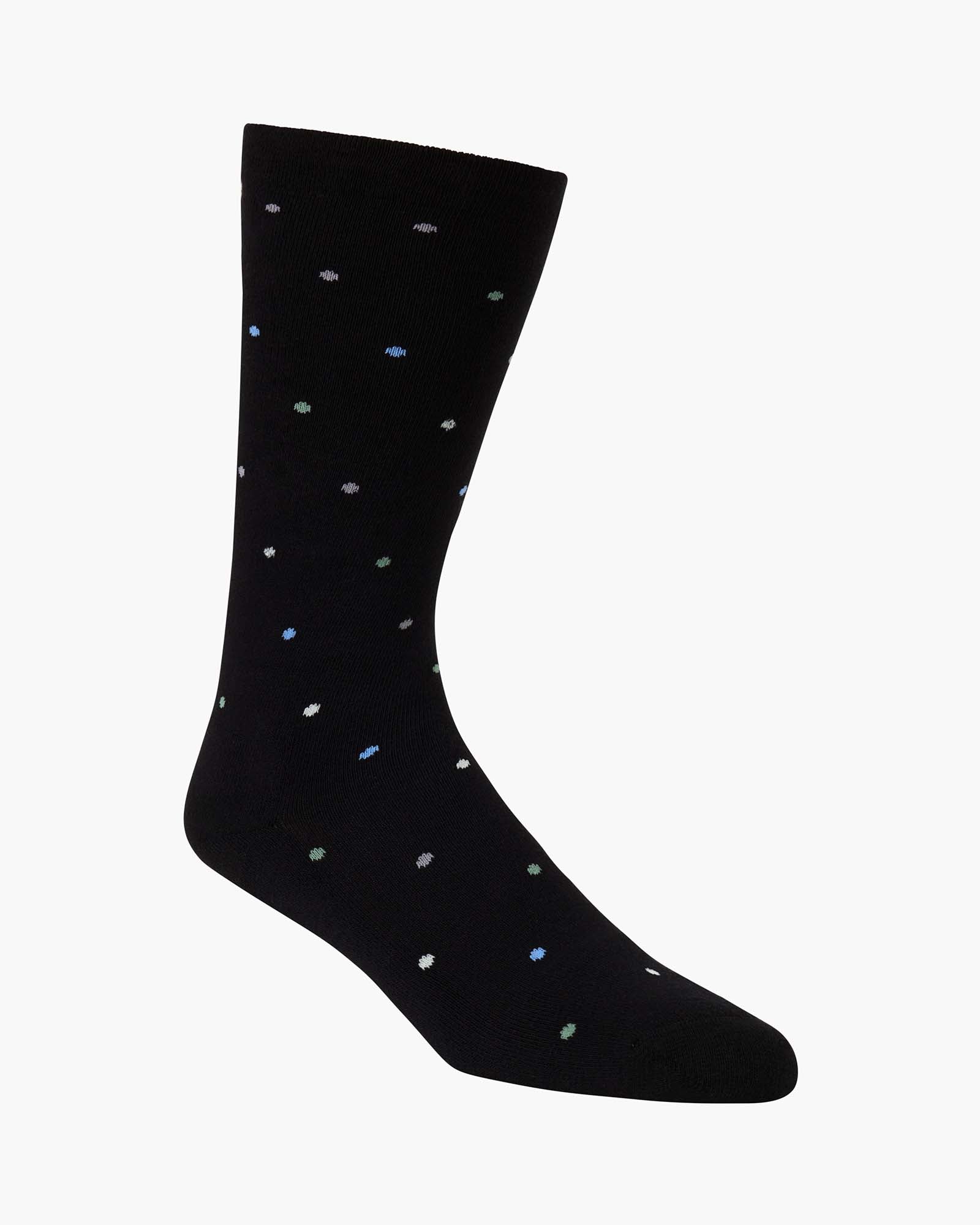 black crew sock with a pattern of small multicolored polka dots