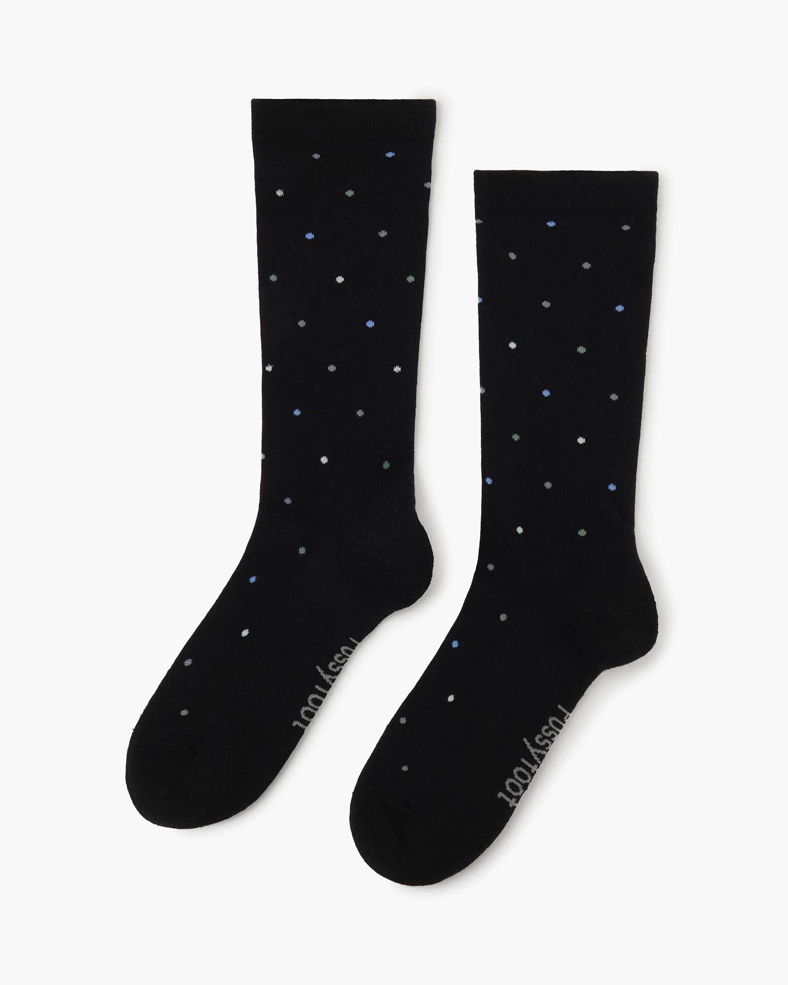 black crew sock with a pattern of small multicolored polka dots