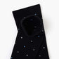 black crew sock with a pattern of small multicolored polka dots