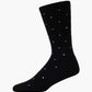 black crew sock with a pattern of small multicolored polka dots