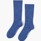 blue crew sock with a scattered polka dot pattern in black, white, and light blue