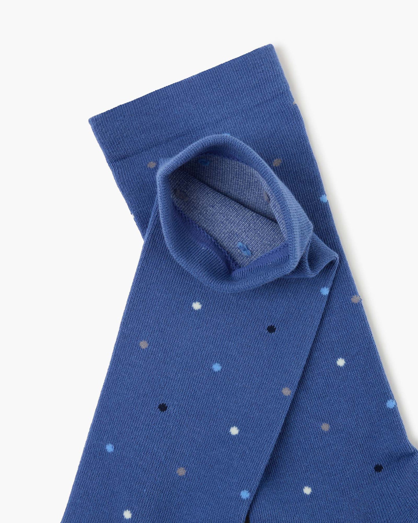 blue crew sock with a scattered polka dot pattern in black, white, and light blue