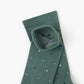 green crew sock with a scattered pattern of small polka dots in white, light blue, and black