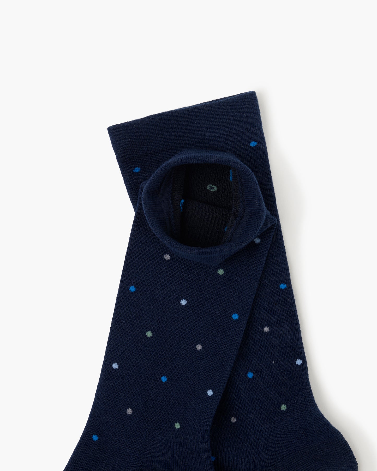 navy crew sock with a pattern of small multicolored polka dots