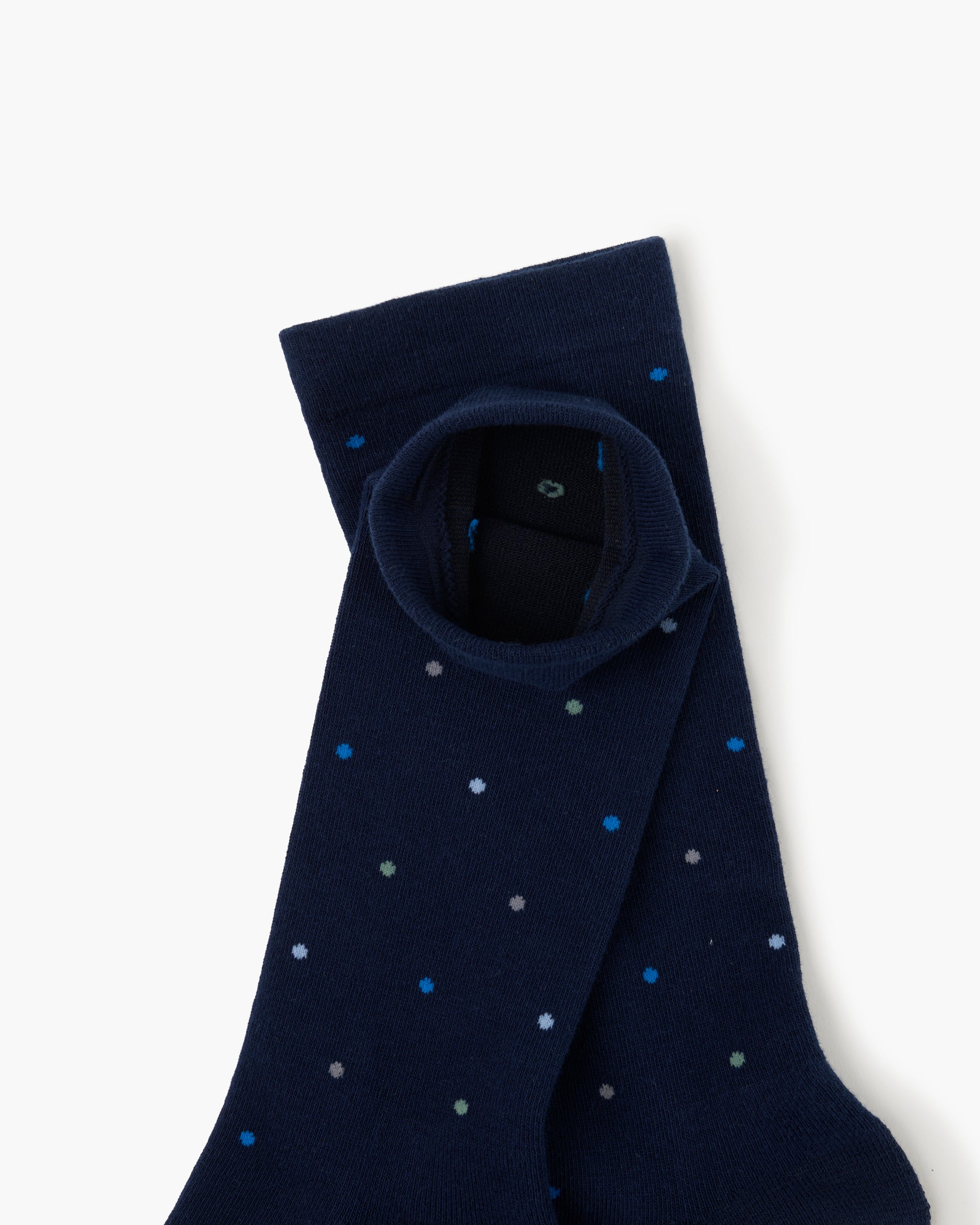 navy crew sock with a pattern of small multicolored polka dots