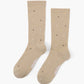 beige crew socks with a pattern of small multicolored polka dots