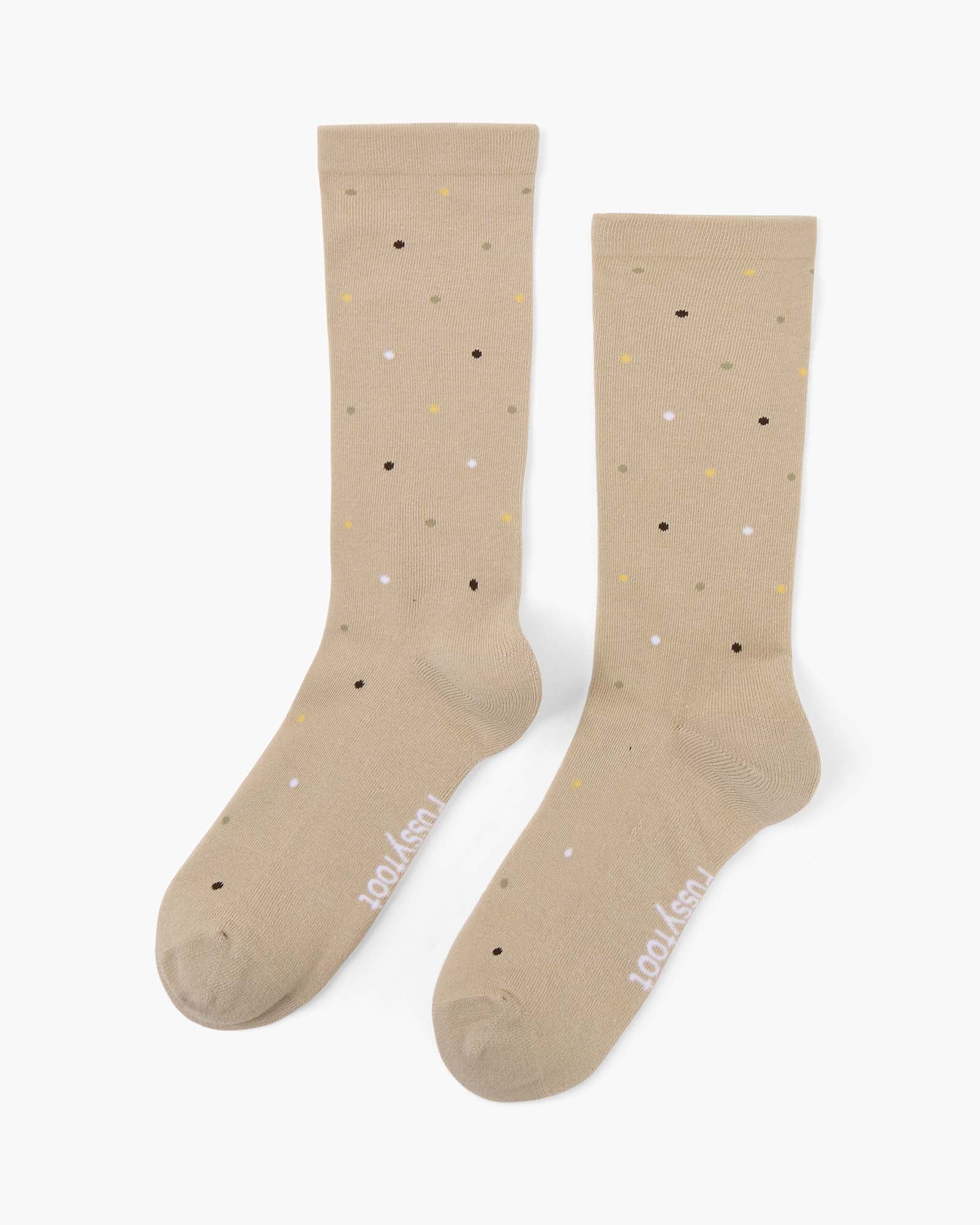 beige crew socks with a pattern of small multicolored polka dots