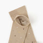 beige crew socks with a pattern of small multicolored polka dots
