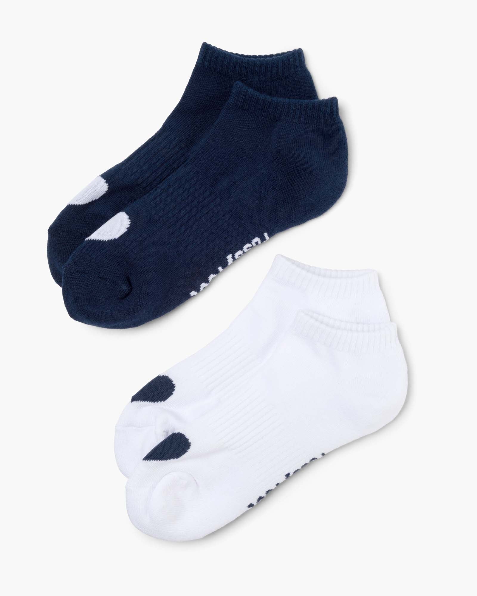Two pairs of ankle socks, one navy and one white, with love heart print design 