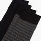Two pairs of socks one striped and one plain sock in black