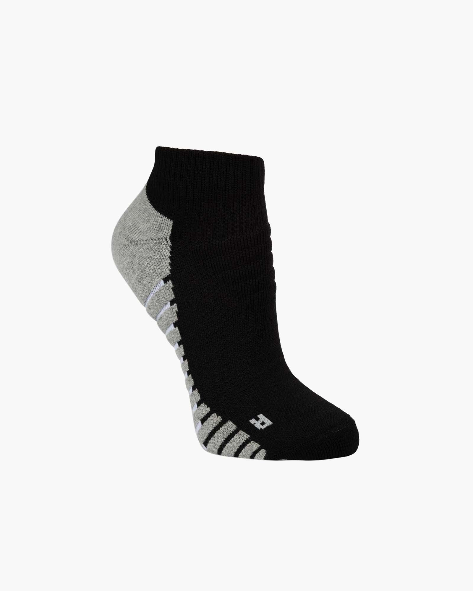 A single low-cut ankle sport sock in black with grey accents on the heel