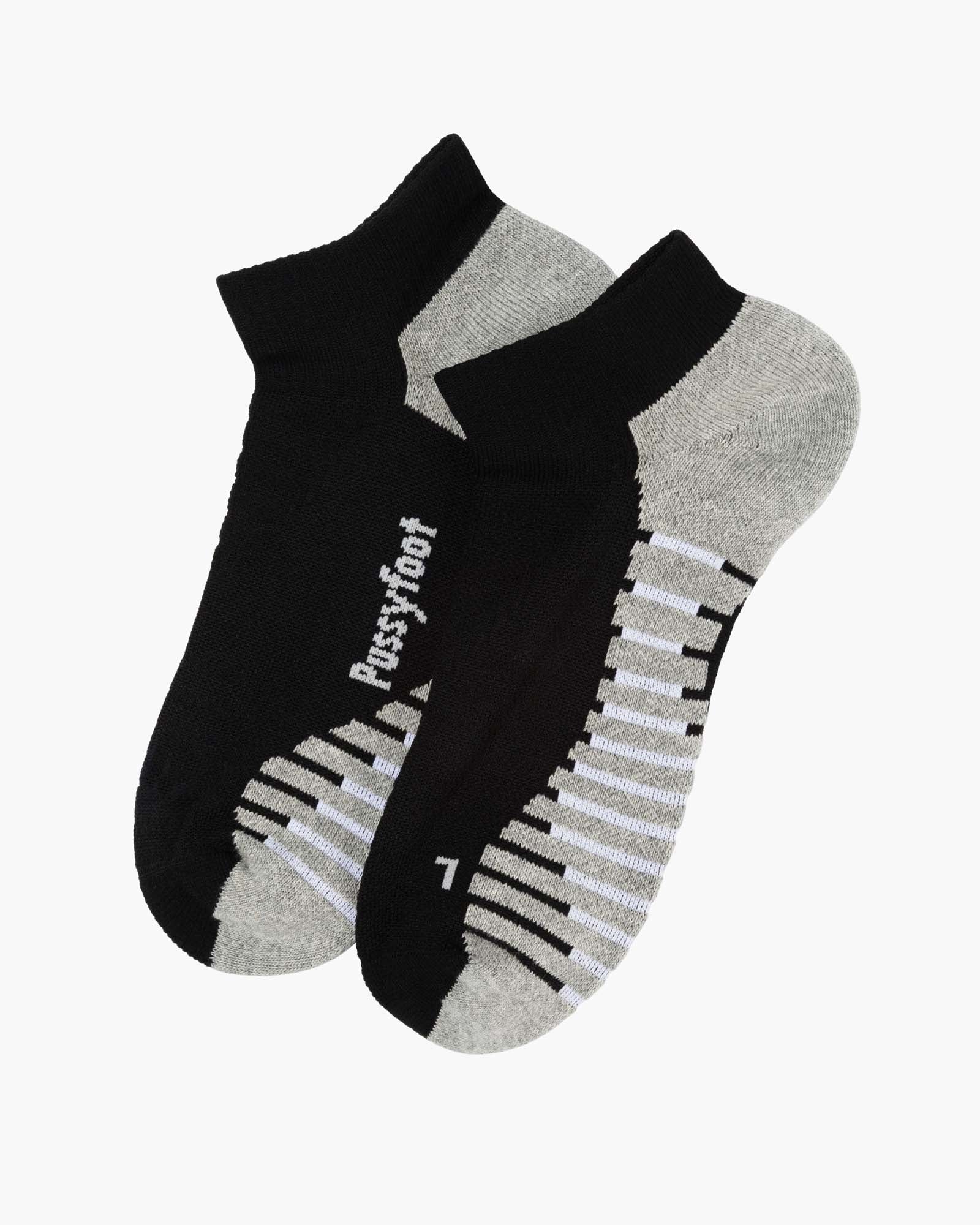 A single low-cut ankle sport sock in black with grey accents on the heel