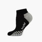 A single low-cut ankle sport sock in black with grey accents on the heel
